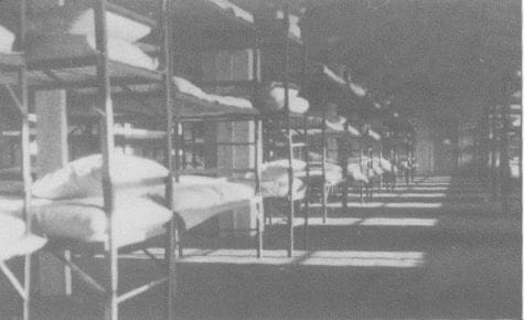 Rows and rows of three-level bunk beds