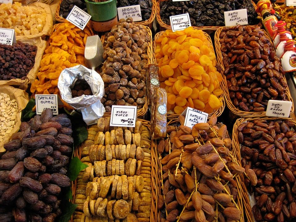 Dates and other sweets at a market. Mixing medicine – Religion and science