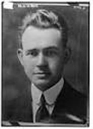 Photo of man with light hair wearing suit