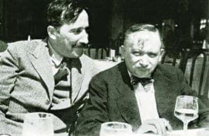 Two men seated with drinks