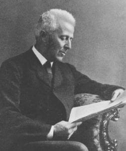 Man with light hair reading