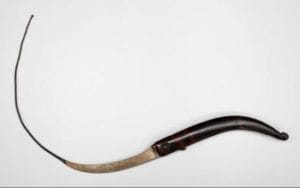 Photograph of a curved blade used by Felix to treat anal fistula.