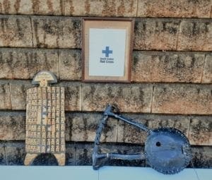 Photograph containing items representative of the Red Cross in South Sudan