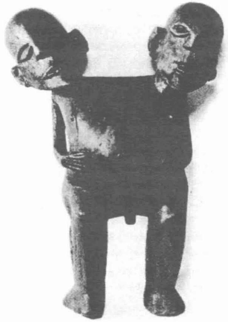 Two headed statue, possibly conjoined twins