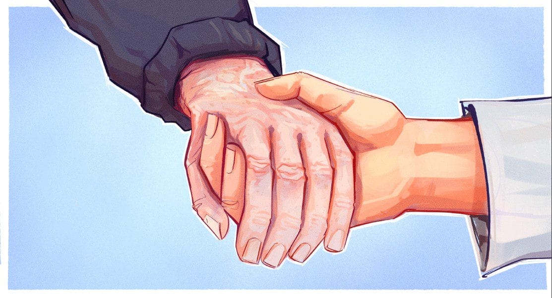Paler hand of an elderly person in a jacket supported by the hand of a medical professional in a white coat on a light blue background