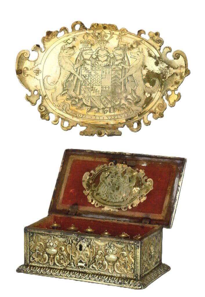 Gold and red medical chest of Sir Walter Raleigh, showing detail of a crest on the inner lid.